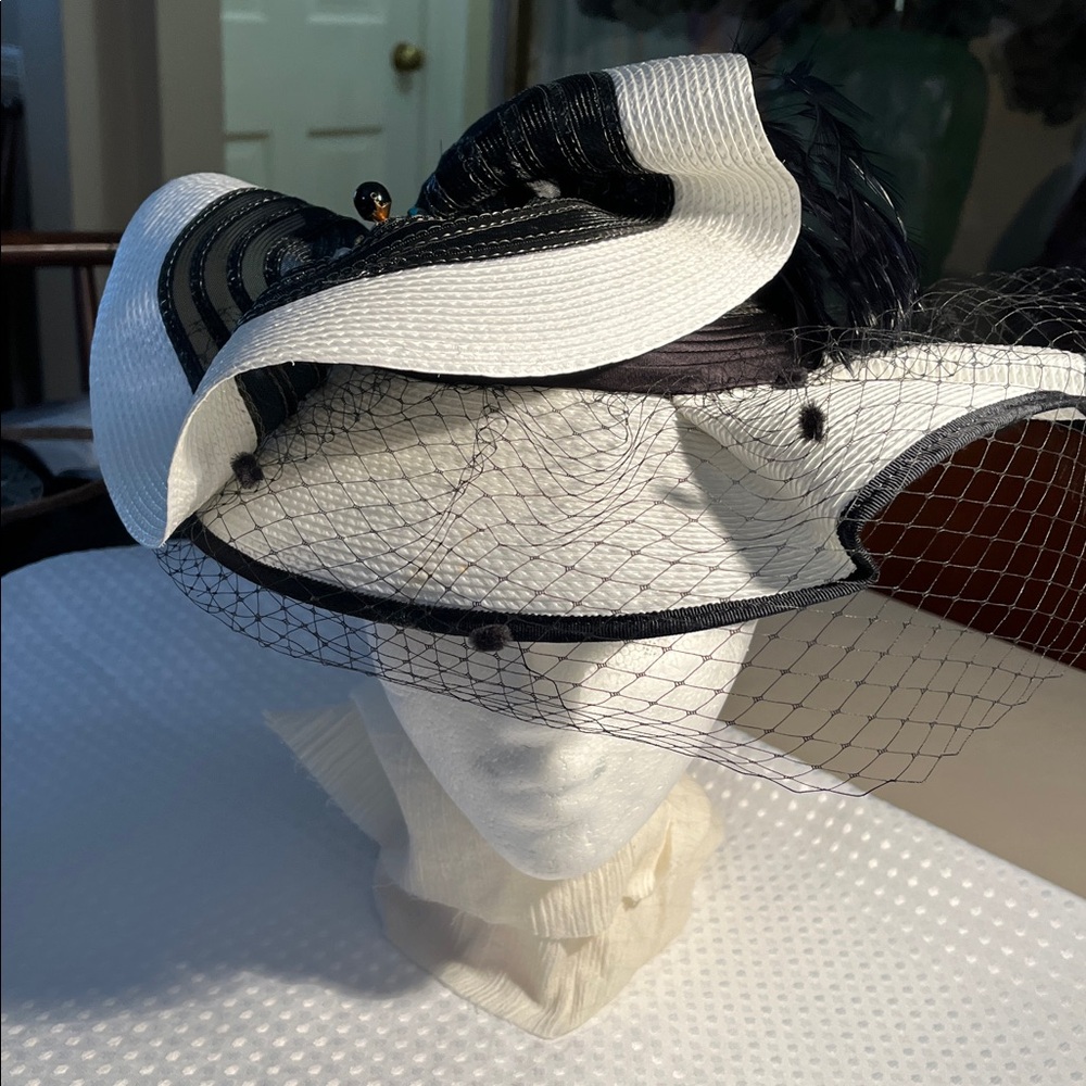 Elegant Black and White Fascinator Hat with Veil and Feather embellishments